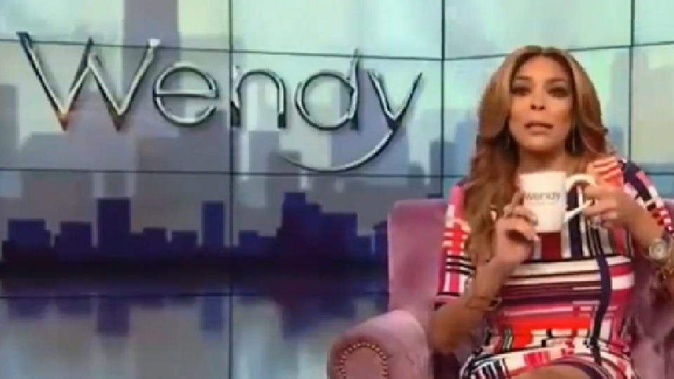 A picture of Wendy Williams on the Wendy Show. She's sitting down and addressing the audience and camera.