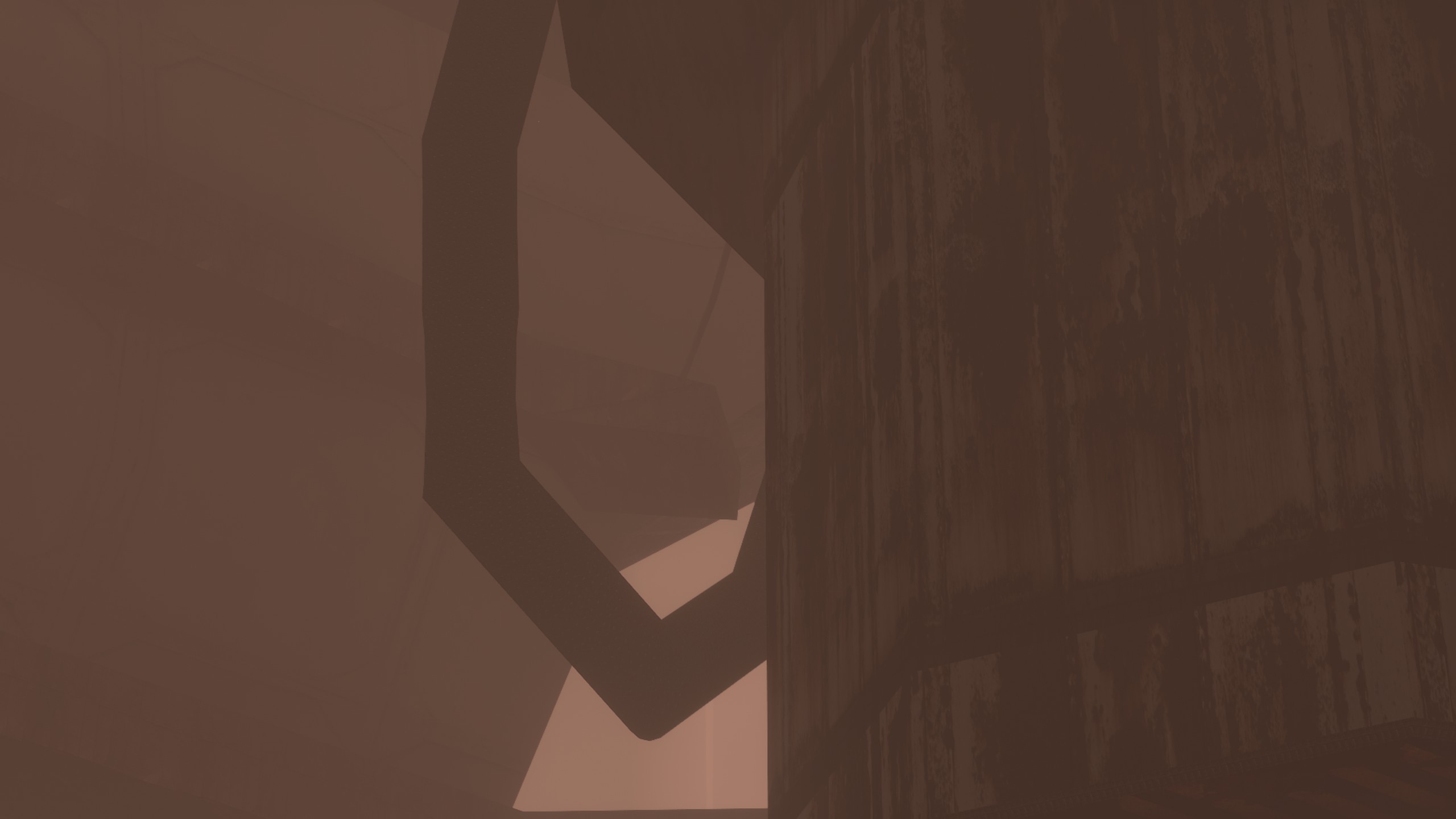 Screenshot of Lorn's Lure, showing the side of a large silo, with a big tube hanging off the side of it.